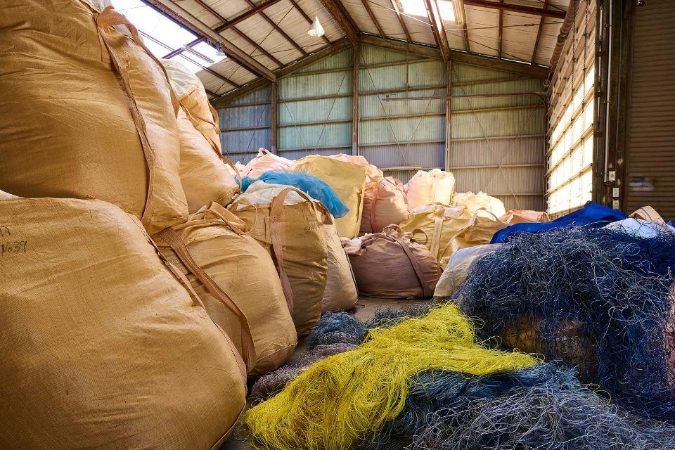 Piles of fishing nets inside amu inc.'s warehouse 